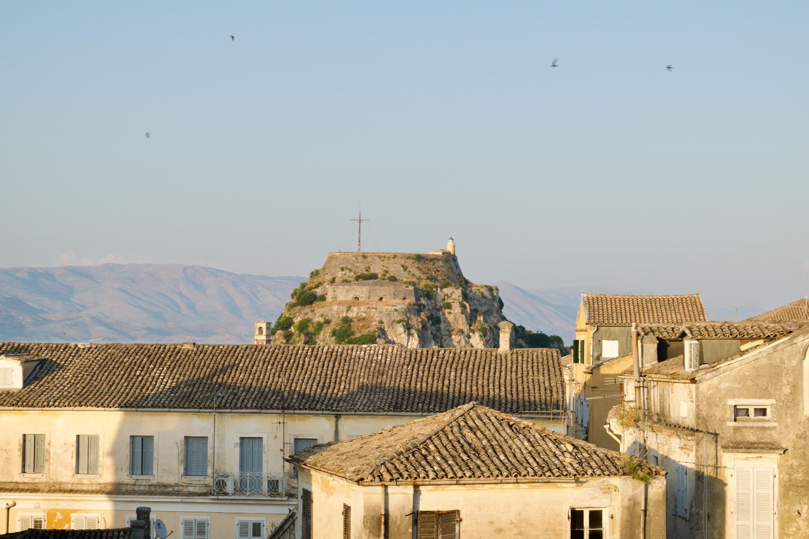 Corfu Old Town rooftops and the Ionian Sea seen from the penthouse