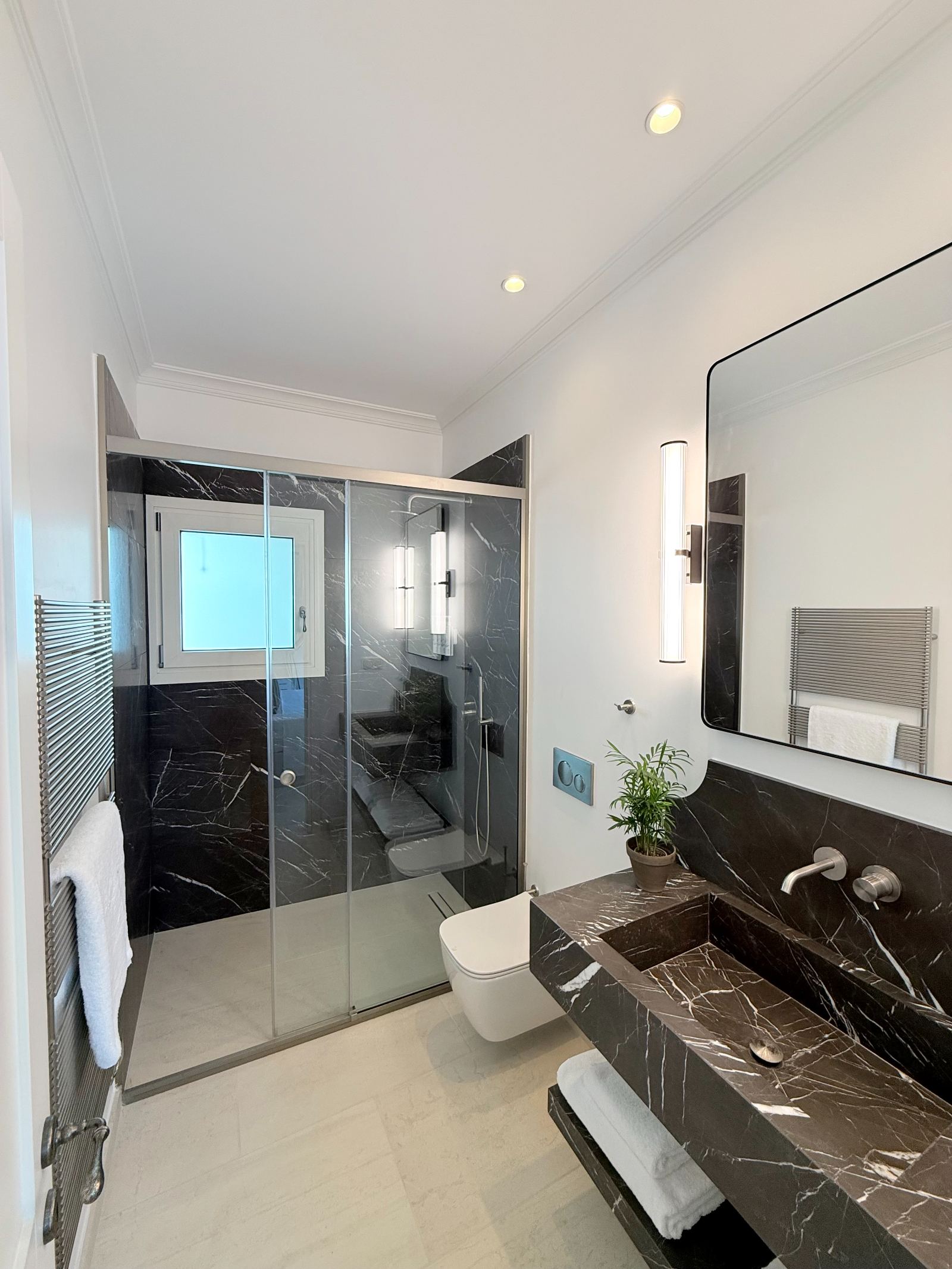 Bathroom in black marble with walk-in shower