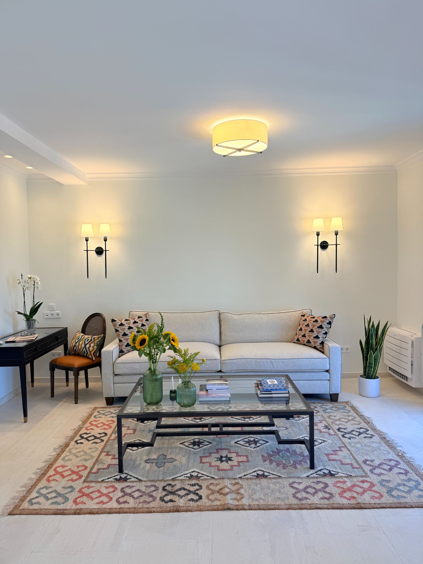 Living room with linen sofa and kilim rug at Terra di Corfu penthouse